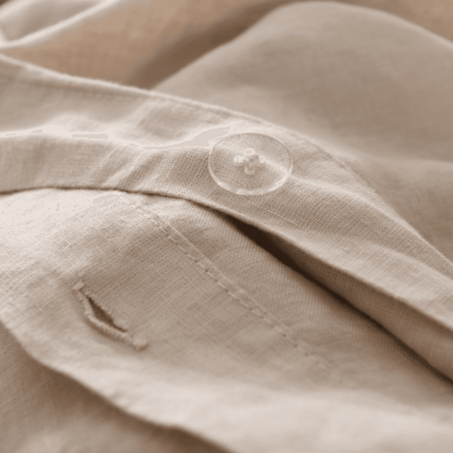 Close-up of beige European Flax Linen Duvet Cover with a button