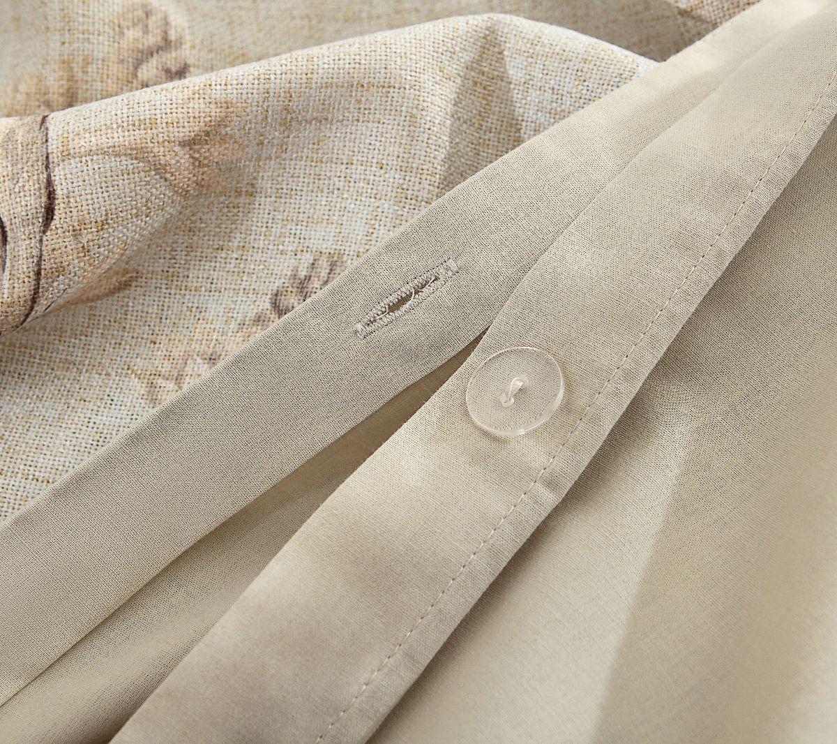Close-up of a beige fabric with a button and stitching detail