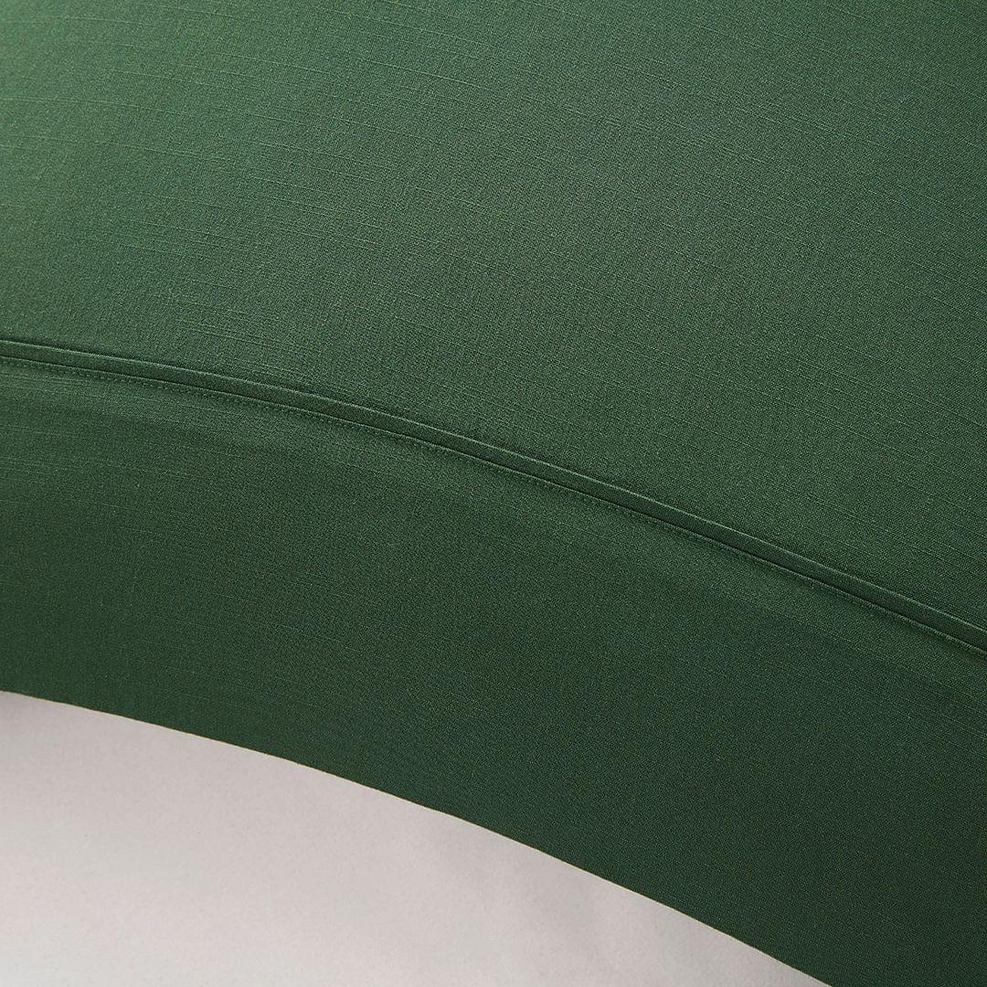 Close-up of a forest green Bamboo Linen Pillowcase Pairs with a subtle pattern