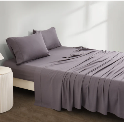 Breathable bamboo and linen bed sheets styled on a comfortable bedroom bed