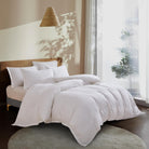 White Aurora Bloom Leaf Jacquard Duvet Cover Set White on a bed in a bright bedroom with natural light.