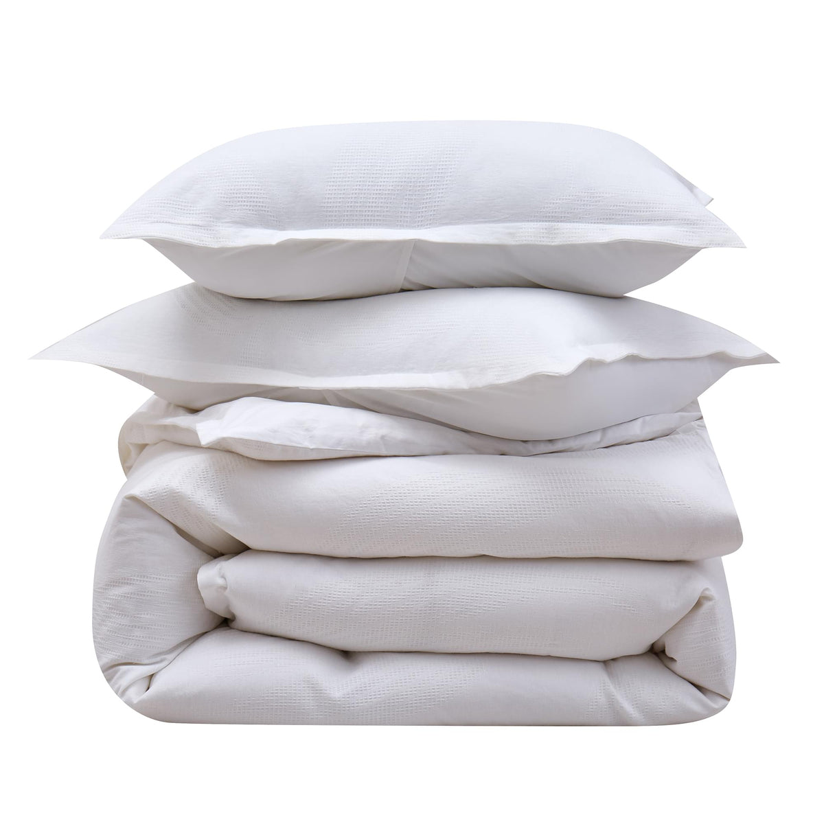 Stack of white pillows and a blanket on a white background