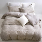 Timeless Heritage Woven Comforter Set with pillows on a bed against a white wall