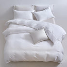 White Aurora Bloom Leaf Jacquard Duvet Cover Set White with duvet and pillows on a light gray background