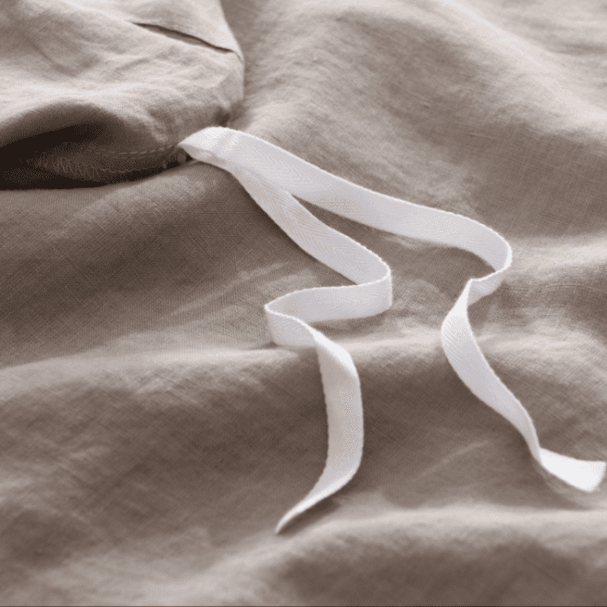 White ribbon on brown fabric