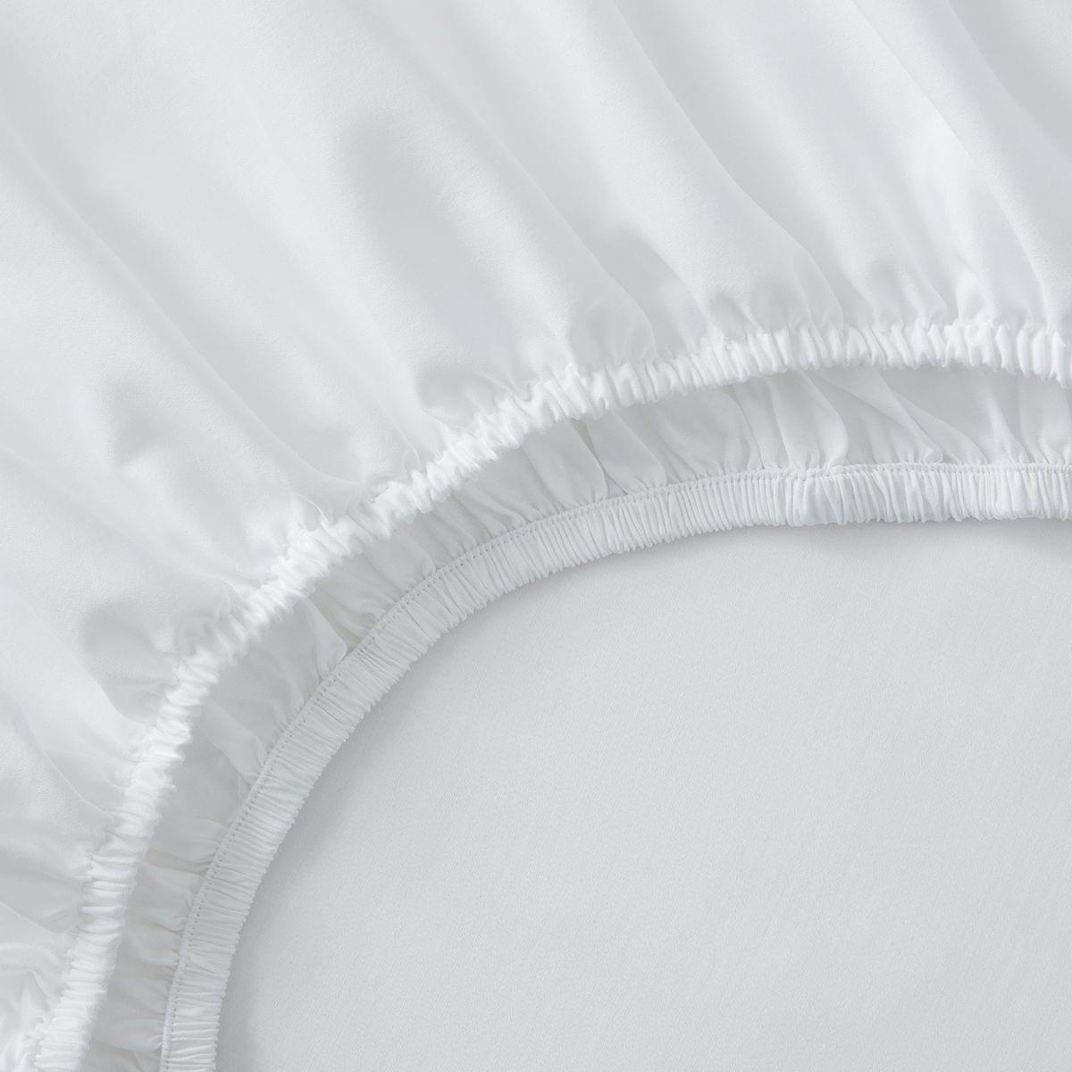 Close-up of a white fitted 100% Cotton Sheet Set 400 Thread Count on a bed