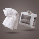 White Down Alternative Gel Microfiber Duvet with packaging on a gray background