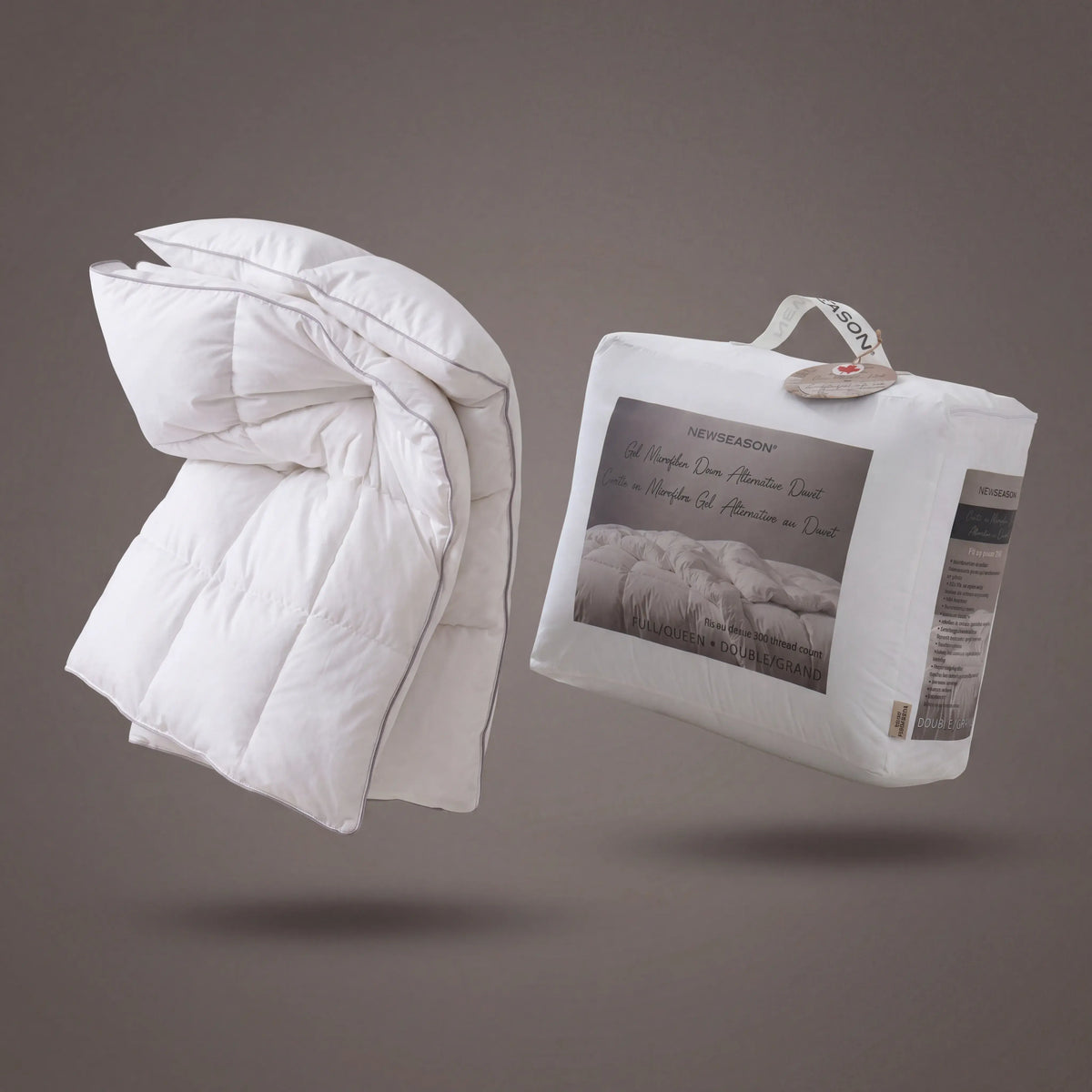 White Down Alternative Gel Microfiber Duvet with packaging on a gray background