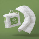 White Down and Feather Duvet and packaging on a green background