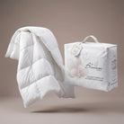 White Down and Feather Products Duvet with packaging on a beige background