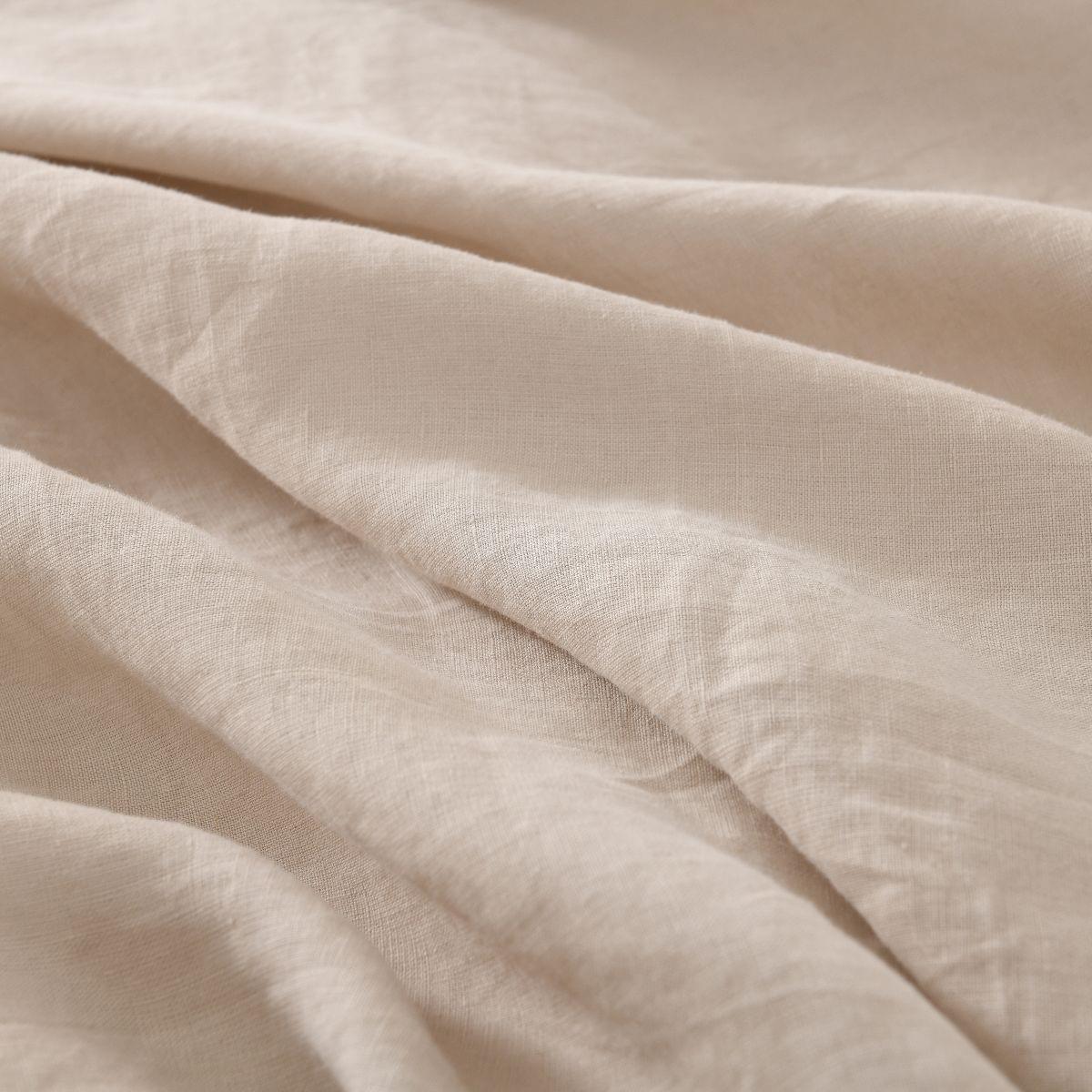 Close-up of beige European Flax Linen Duvet Cover fabric with soft texture