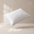 White Down Alternative Gel Microfiber Pillow on a beige background