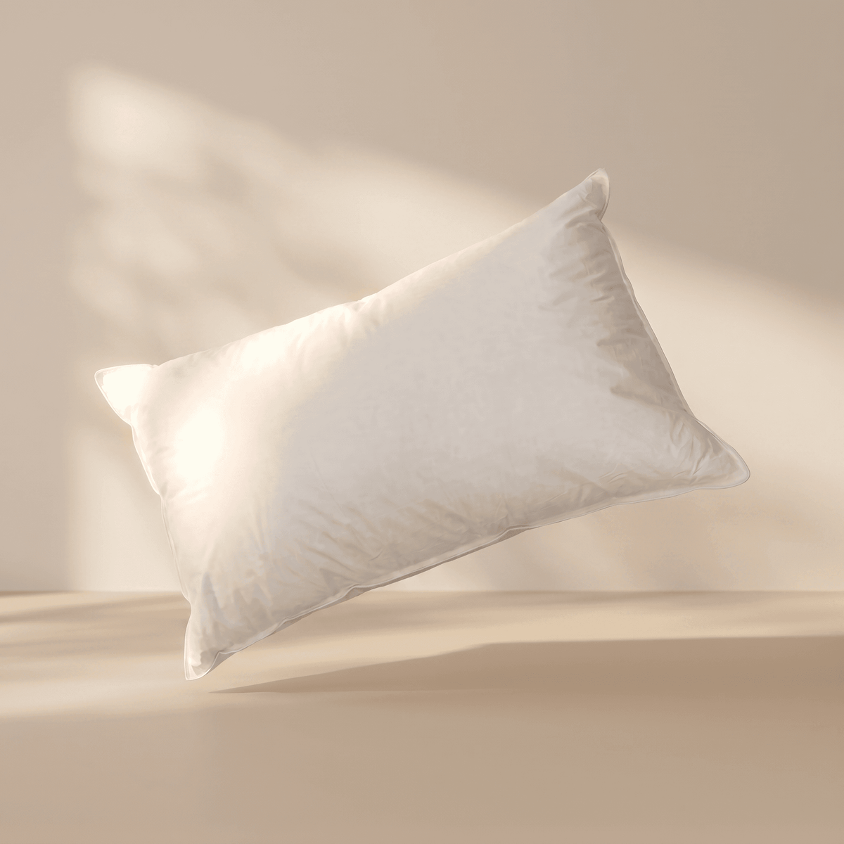 White pillow on a beige background
