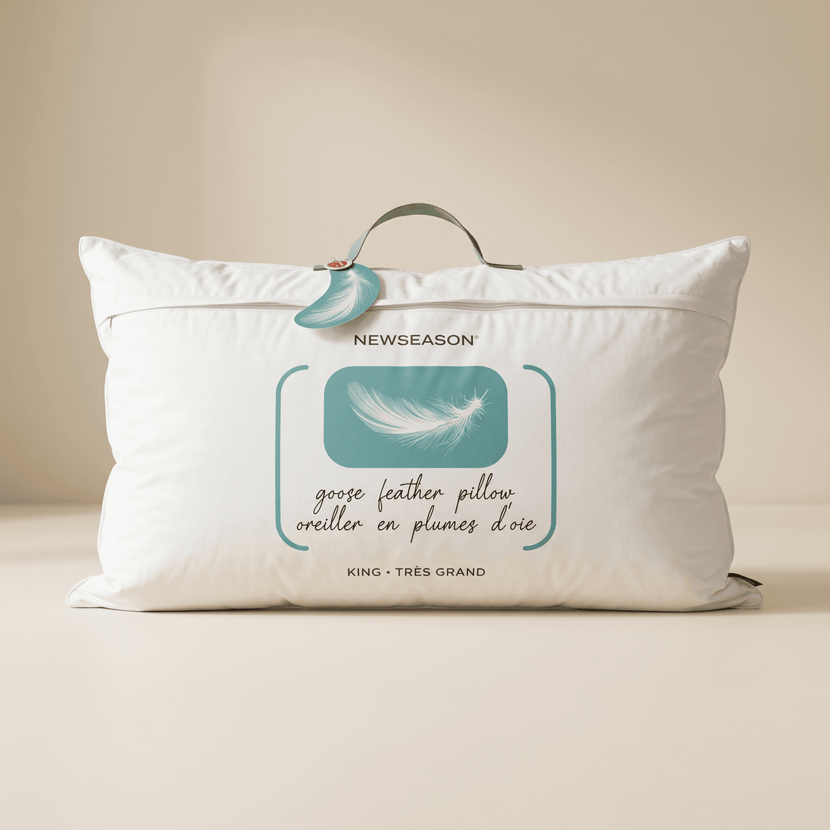 Goose feather pillow with Newseason label on a beige background