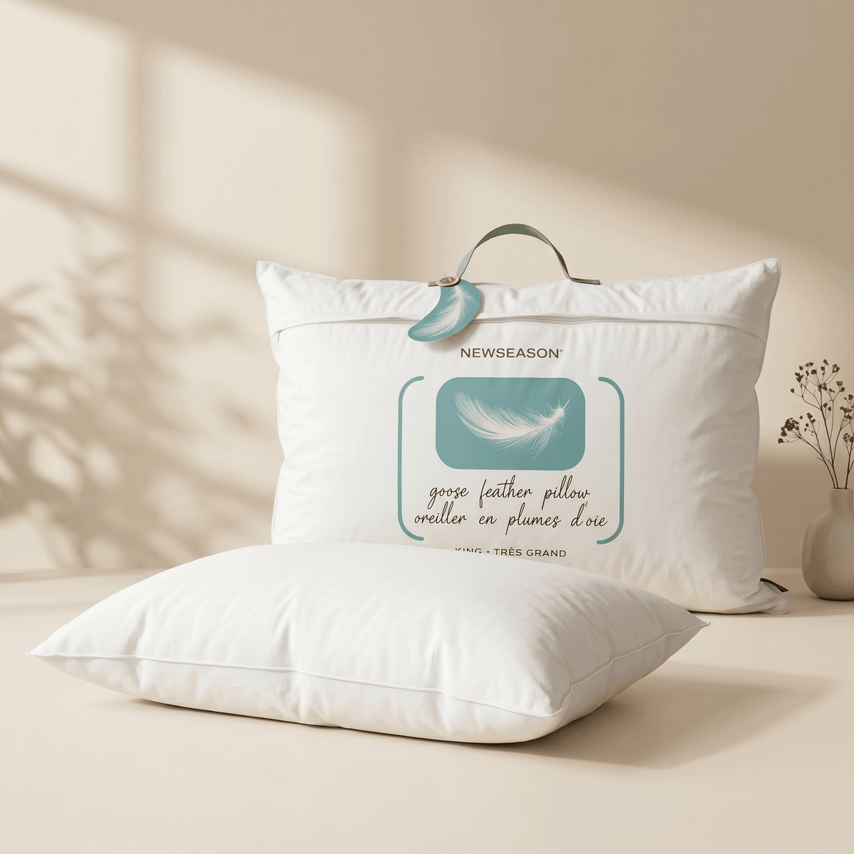 Two White Goose Feather Pillows with a New season label on a beige background