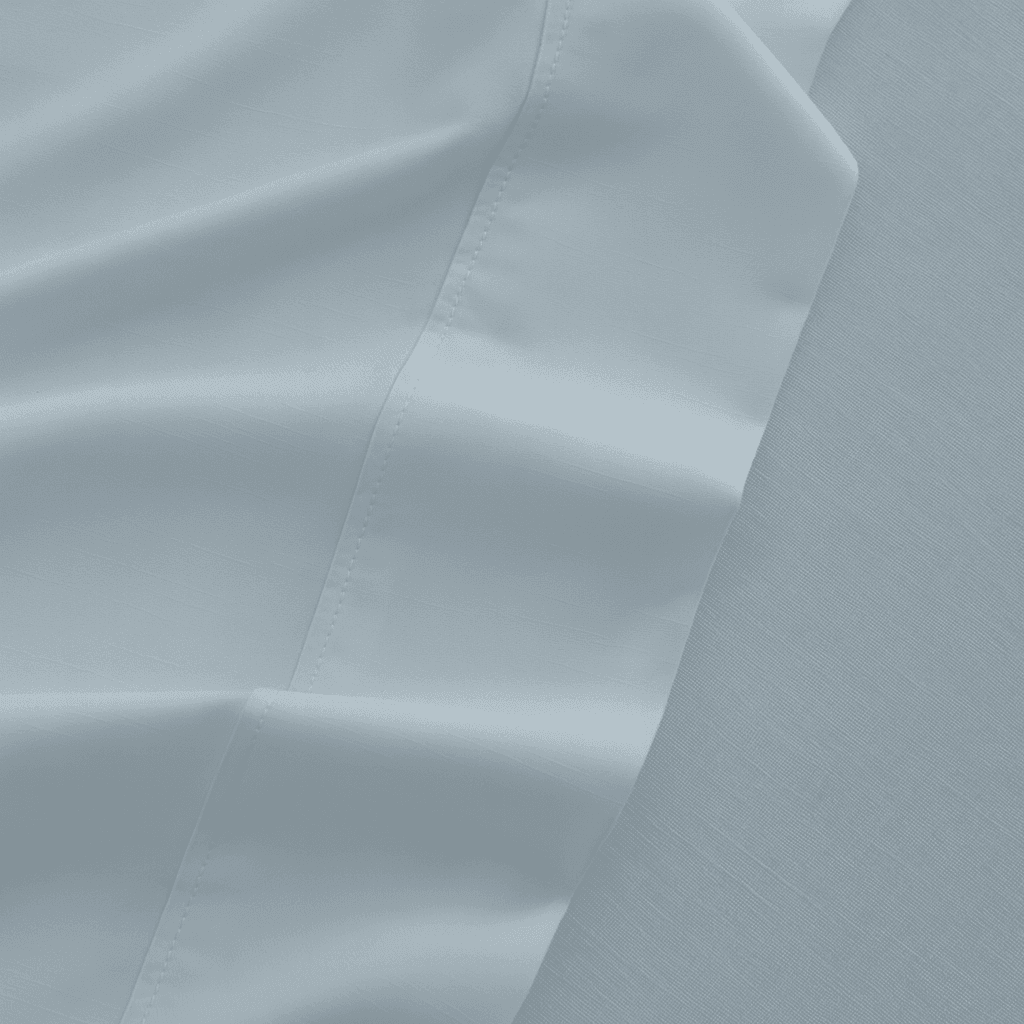 Close-up of light gray fabric with subtle texture