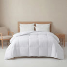 White White Goose Feather Duvet set on a bed in a bedroom with beige walls and furniture.