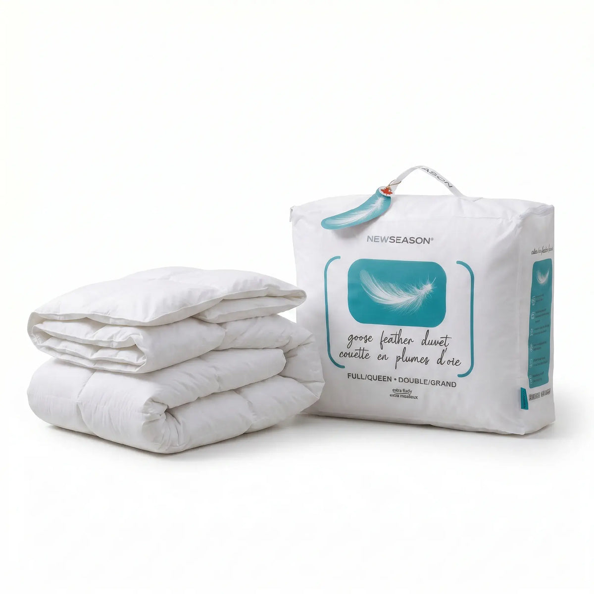 A folded white goose feather duvet next to its white branded storage bag on a clean white background. The bag features a teal graphic of a feather and text reading 'NEWSEASON goose feather duvet'.