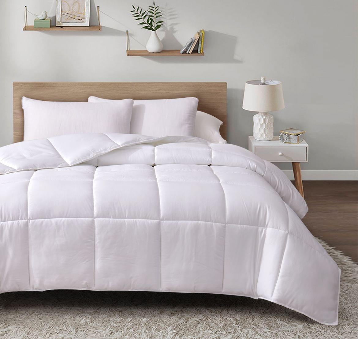 White Bamboo Duvet White Insert on a bed in a bedroom setting with shelves and a lamp.