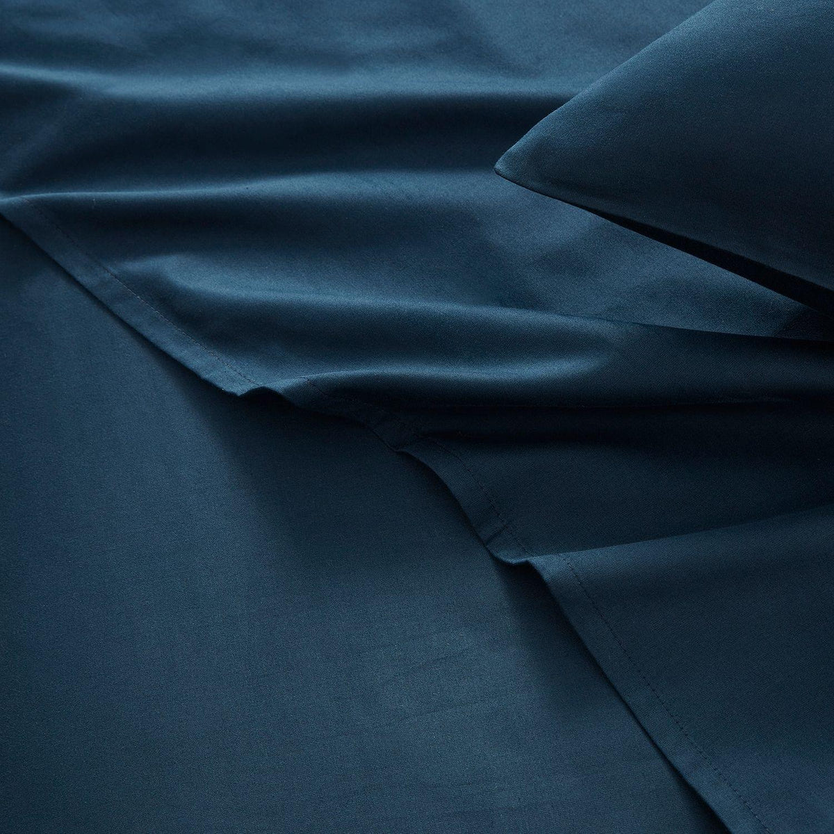 Dark blue fabric with a pillow and sheet set
