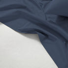 Dark blue 600 Thread Count Cotton Bed Sheet Set fabric on a light gray background