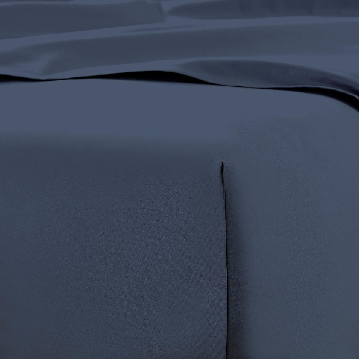 Close-up of dark blue 600 Thread Count Cotton Bed Sheet Set with a subtle texture.
