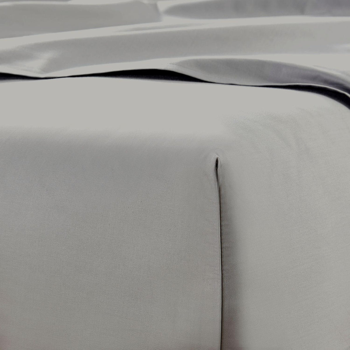 Close-up of gray bedding with a subtle texture